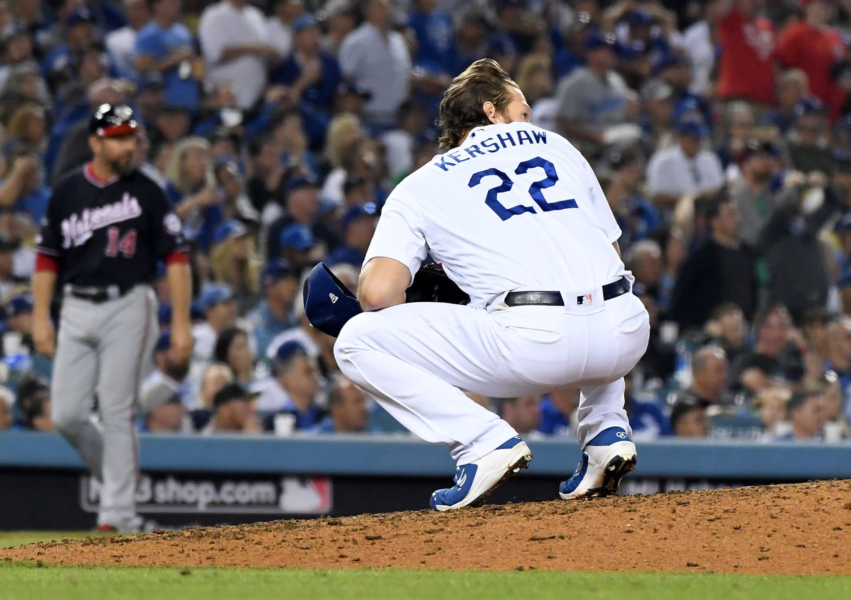 Los Angeles Dodgers pitcher Clayton Kershaw (22) watches as a solo home run by the Washington Nationals' Juan Soto leaves the park, tyring the game, 3-3, in the eighth inning during Game 5 of the National League Division Series at Dodger Stadium in Los Angeles on Wednesday, Oct. 9, 2019.